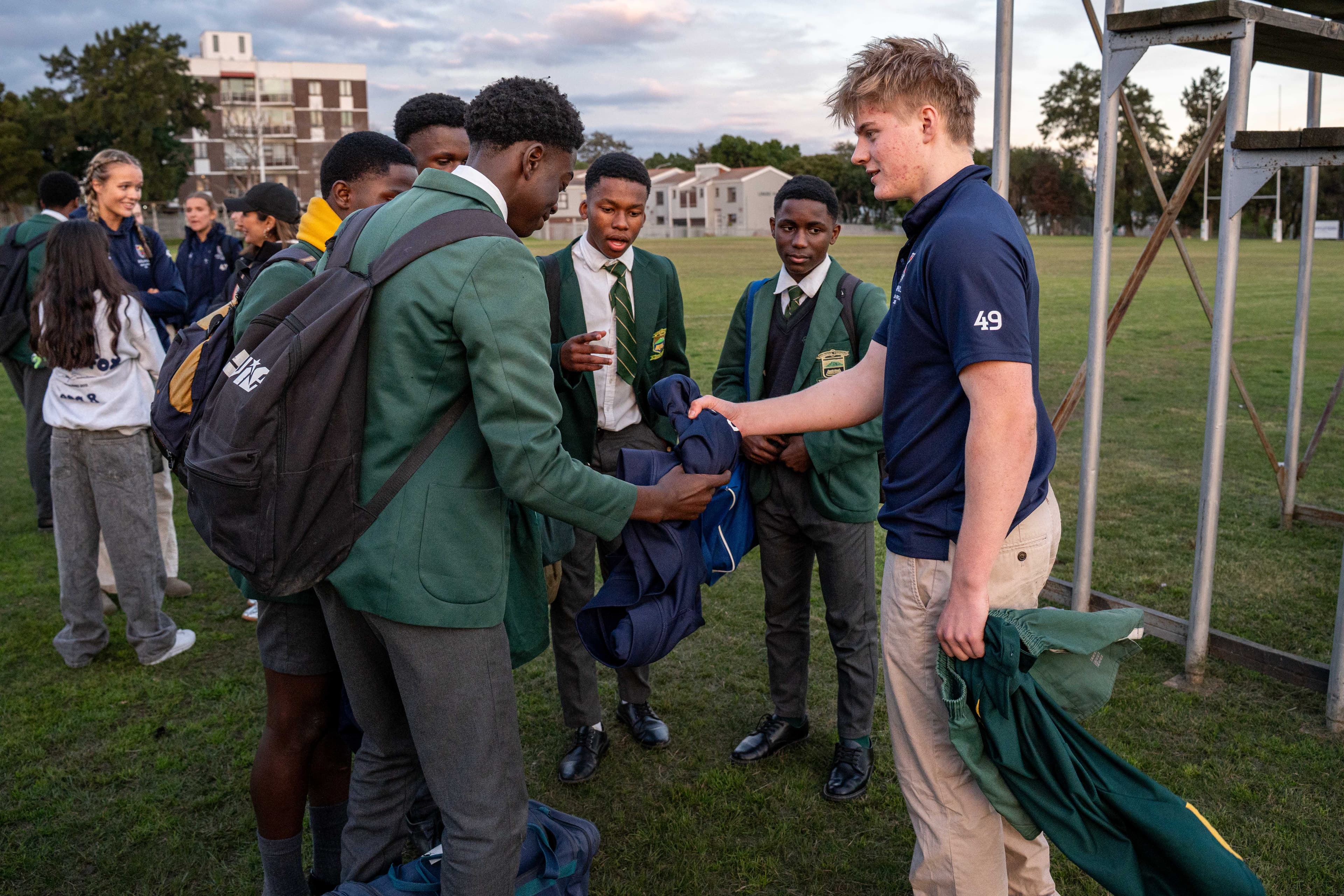 Rugby tour, candid kit exchange between players, Cape Town