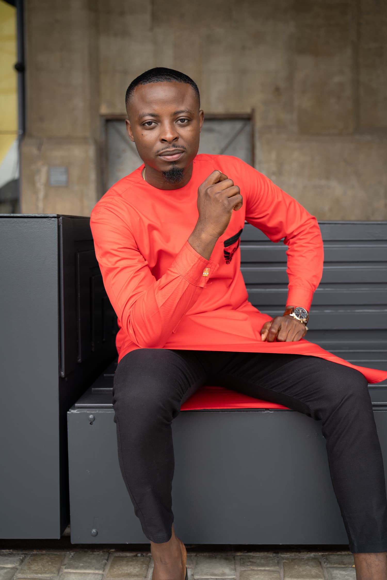 Rotary International Magazine portrait, red outfit, seated