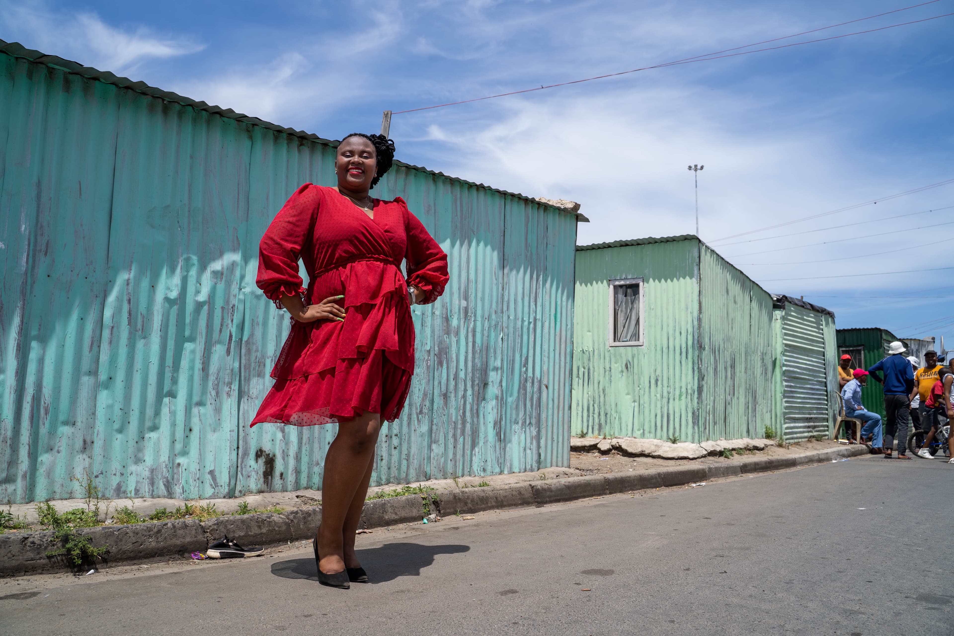 Woman in a red dress, township street photography, Cape Town