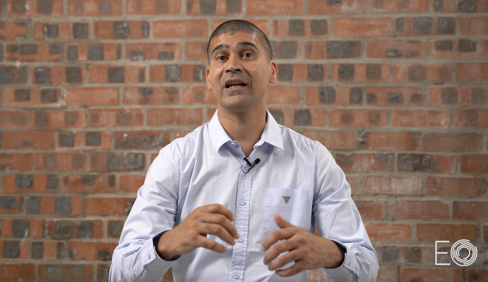 Training video presenter, brick wall backdrop, Cape Town