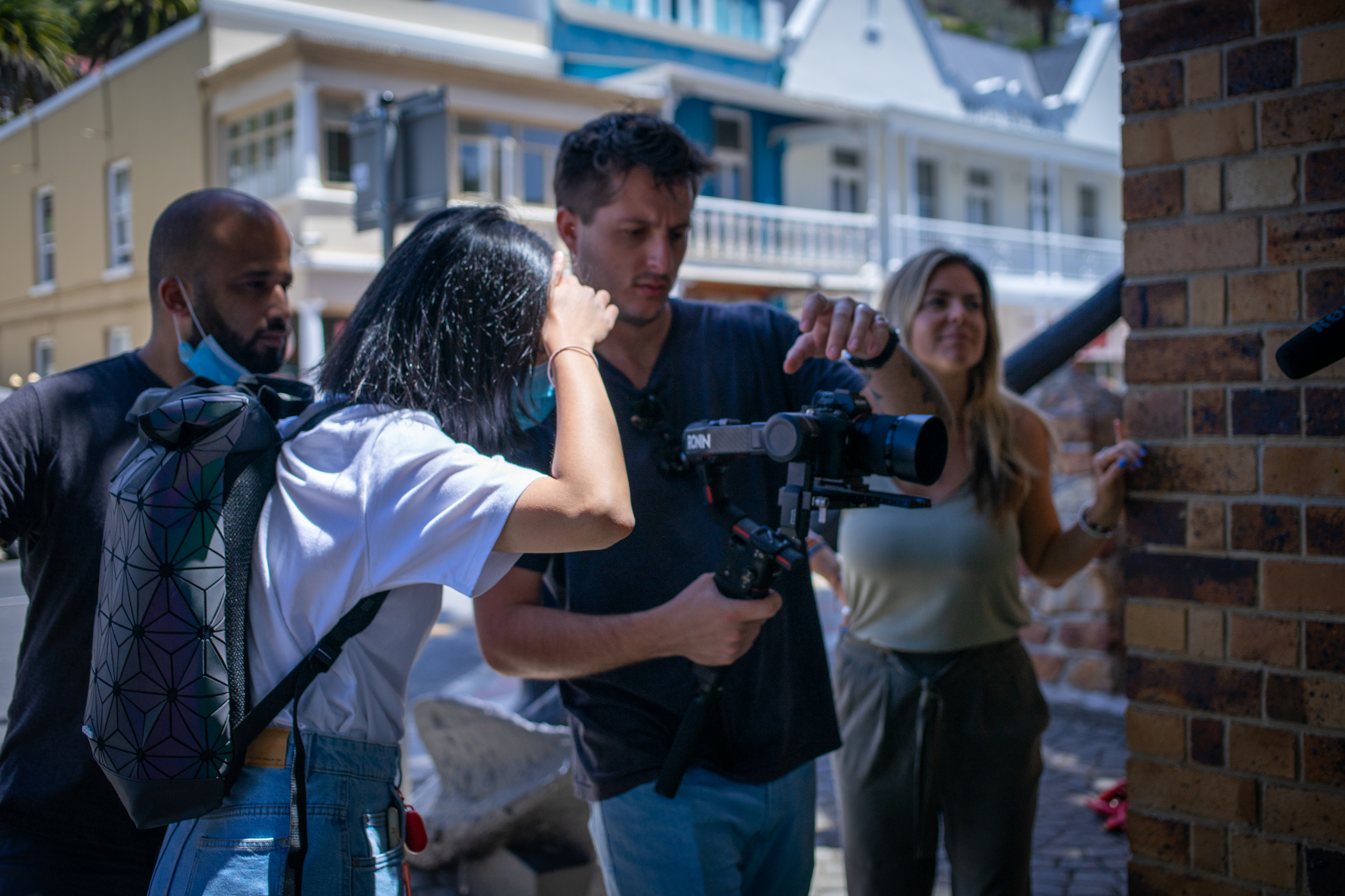 Film crew setting up equipment on location in Bo-Kaap, Cape Town