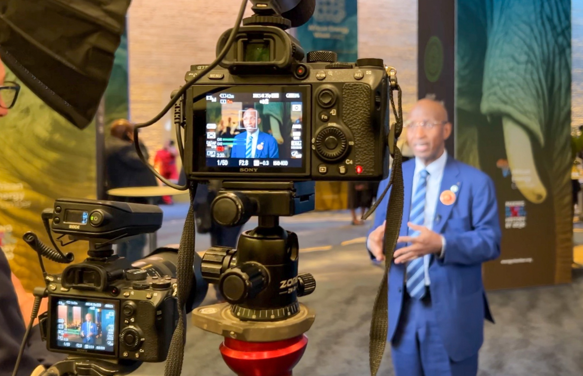Dual-camera close-up interview setup at a conference