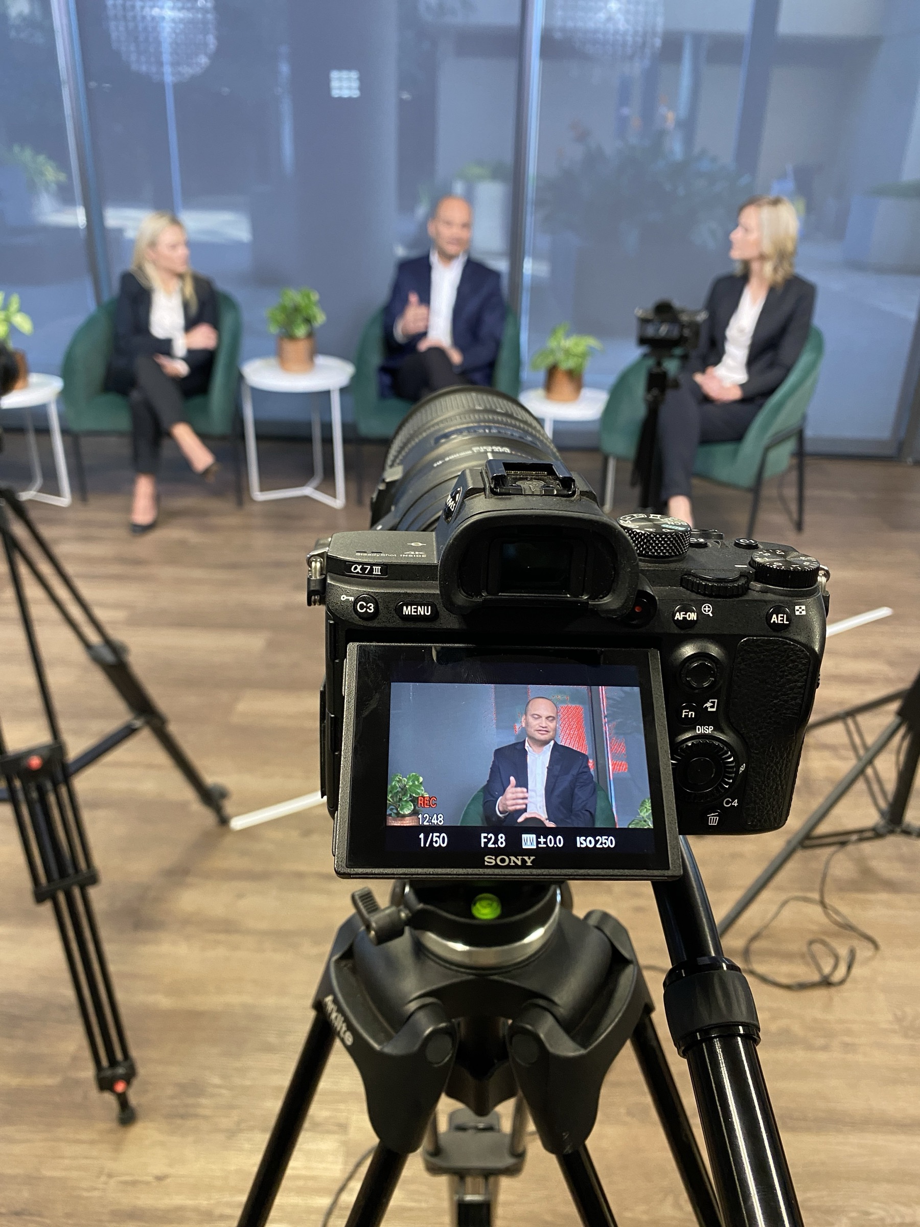 Camera monitor view of a corporate panel interview setup
