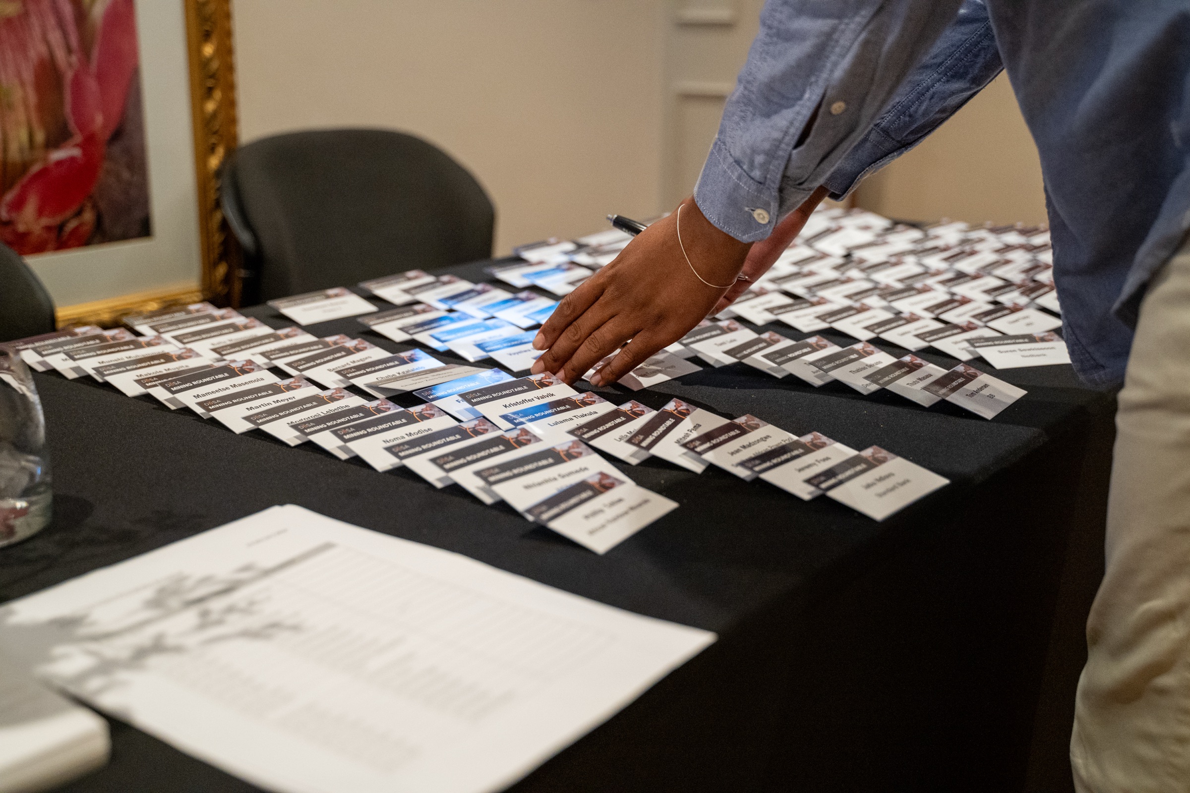 Name tags laid out ahead of a mining roundtable event, detail shot